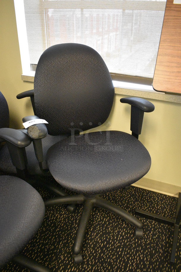 7 Office Chairs w/ Arm Rests on Casters. 24x22x39. 7 Times Your Bid! (room 220)