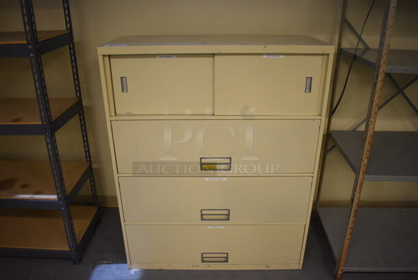 Tan Metal Filing Cabinet. 42x18x52. (south basement 019)