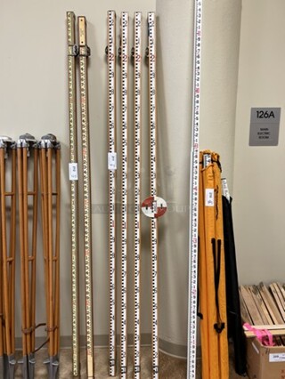 4 Measuring Sticks. 89". 4 Times Your Bid! (room 122)