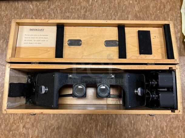 Black Metal Eye Instrument in Wooden Case. 19x5.5. (room 122)