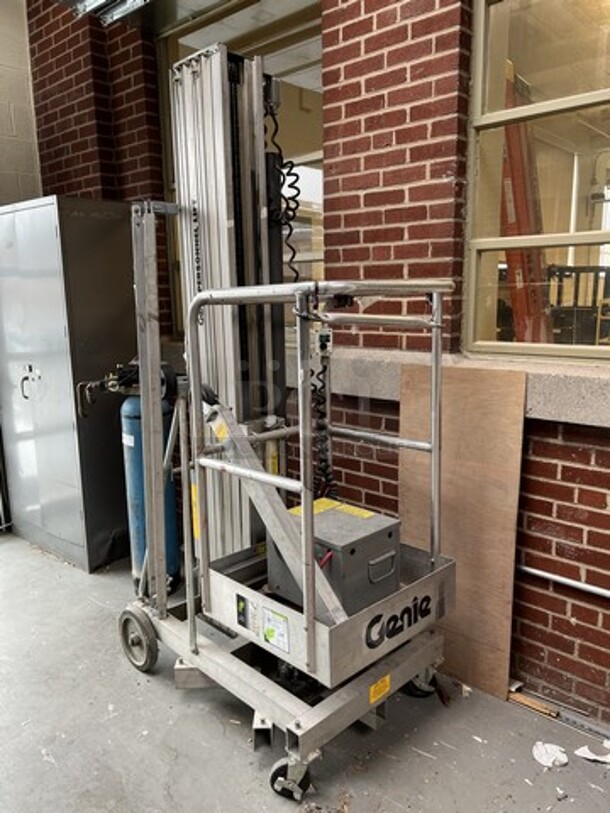 Genie Model PLC-30DC Metal Personnel Lift. 300 Pound Capacity. Unit Needs a New Chain. 28x48x91. (loading dock)