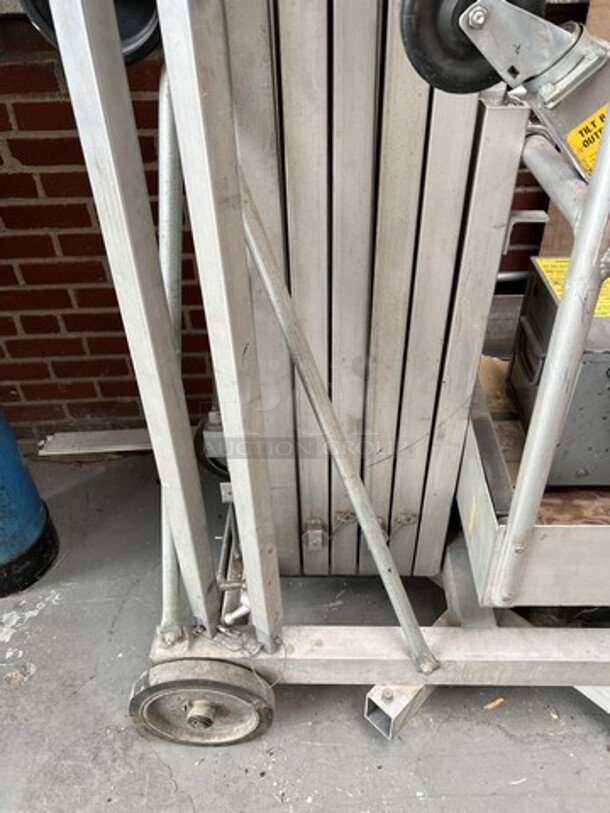 Genie Model PLC-30DC Metal Personnel Lift. 300 Pound Capacity. Unit Needs a New Chain. 28x48x91. (loading dock) - Image 3 of 12