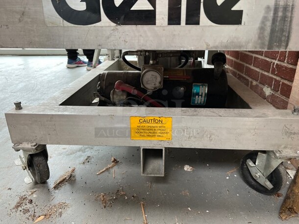 Genie Model PLC-30DC Metal Personnel Lift. 300 Pound Capacity. Unit Needs a New Chain. 28x48x91. (loading dock) - Image 9 of 12