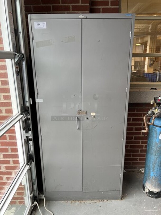 Gray Metal 2 Door Cabinet. 36x18x78. (loading dock)