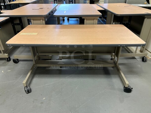 6 Wood Pattern Tables on Metal Frame w/ Casters. 60x30x31. 6 Times Your Bid! (room 130)