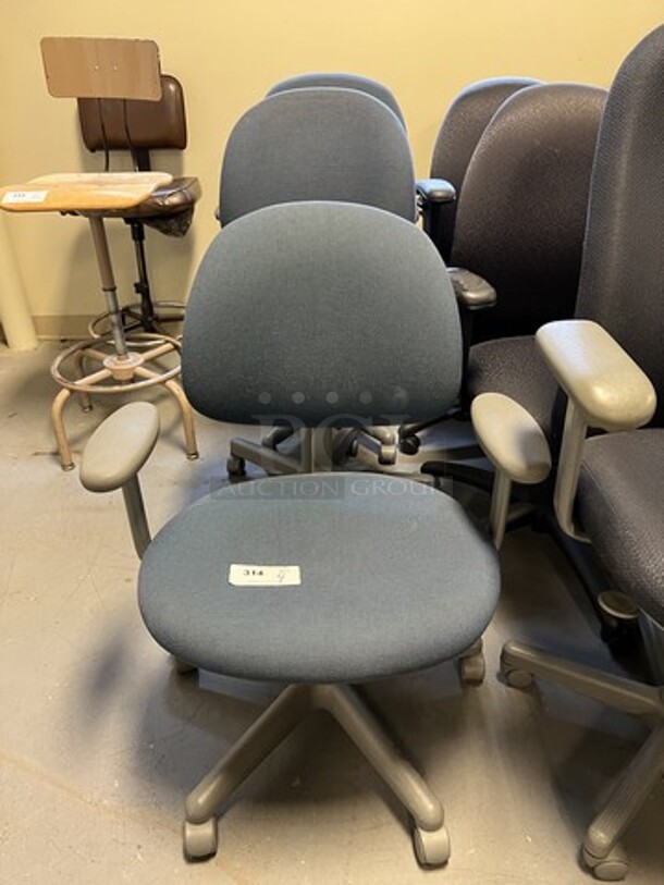 4 Blue Office Chairs w/ Arm Rests on Casters. Includes 26x22x35. 4 Times Your Bid! (room 130)