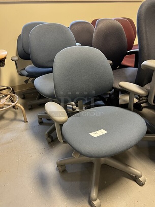 4 Blue Office Chairs w/ Arm Rests on Casters. Includes 26x22x35. 4 Times Your Bid! (room 130) - Image 2 of 4