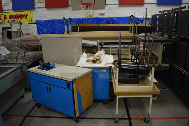 ALL ONE MONEY! Lot of Various Items Including Tables, Cabinet, Desks, Blue Portable Cabinets. Does Not Include Portable Record Players. BUYER MUST REMOVE. Includes 33.5x25.5x39.5. (Clearview Elementary - Gym)