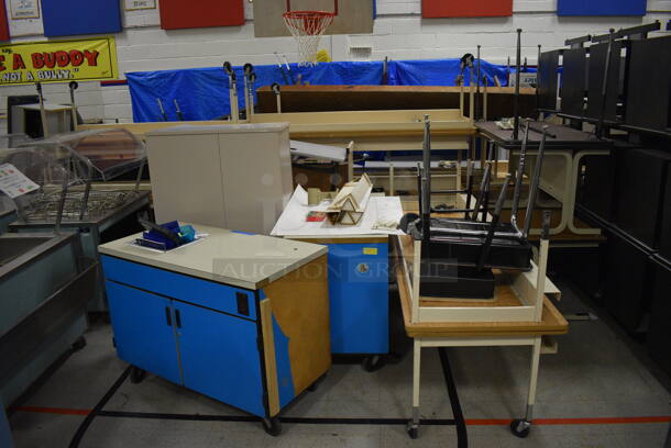ALL ONE MONEY! Lot of Various Items Including Tables, Cabinet, Desks, Blue Portable Cabinets. Does Not Include Portable Record Players. BUYER MUST REMOVE. Includes 33.5x25.5x39.5. (Clearview Elementary - Gym) - Image 1 of 6