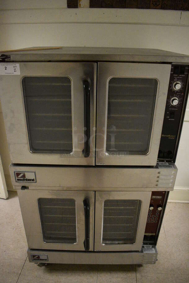 2 Southbend Marathoner Gold Stainless Steel Commercial Gas Powered Full Size Convection Ovens w/ View Through Doors, Metal Oven Racks and Thermostatic Controls on Commercial Casters. BUYER MUST REMOVE. 38x42x63.5. 2 Times Your Bid! (Clearview Elementary - Upstairs Hallway)