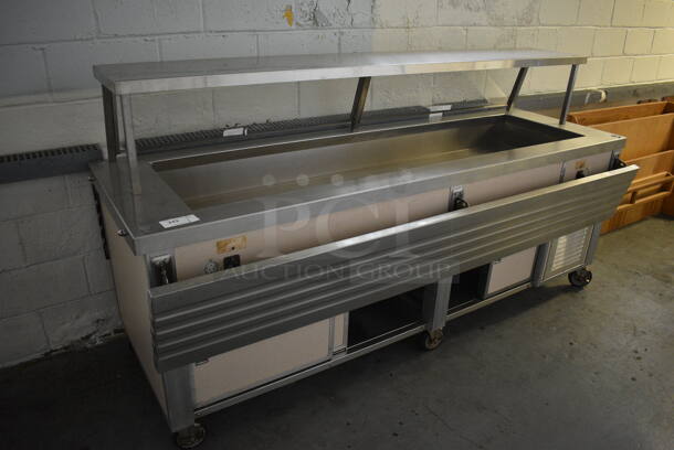 Servolift Eastern Model 502-4R Metal Commercial Portable Refrigerated Buffet Station w/ Sneeze Guard and Tray Slide on Commercial Casters. BUYER MUST REMOVE. 120/208 Volts, 1 Phase. 92x52.5x48.5. (Clearview Elementary - Lower Level)