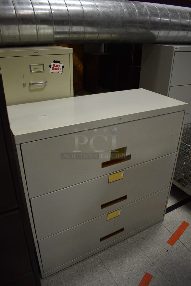 ALL ONE MONEY! Lot of Various Items Including Desks, Filing Cabinets, Stainless Steel Sink. Does Not Include Metal Pan Transport Rack, Metal Baskets, Ramp and One Tan File Drawer Cabinet. BUYER MUST REMOVE. Includes 60x28x29. (Clearview Elementary - Gym) - Image 3 of 12