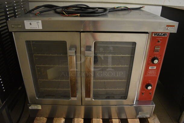 Vulcan Stainless Steel Commercial Gas Powered Full Size Convection Oven w/ View Through Doors, Metal Oven Racks and Thermostatic Controls. Goes GREAT w/ Lot 7! BUYER MUST REMOVE. 40.5x34x31. (Clearview Elementary - Upstairs Hallway)