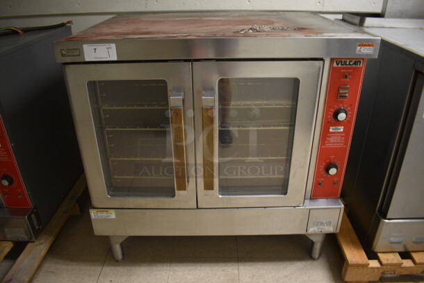Vulcan Stainless Steel Commercial Gas Powered Full Size Convection Oven w/ View Through Doors, Metal Oven Racks and Thermostatic Controls. Goes GREAT w/ Lot 6! BUYER MUST REMOVE. 40.5x35x39. (Clearview Elementary - Upstairs Hallway)