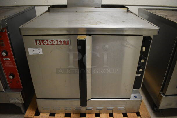 Blodgett Stainless Steel Commercial Full Size Convection Oven w/ Solid Doors, Metal Oven Racks and Thermostatic Controls. Goes GREAT w/ Lot 9! BUYER MUST REMOVE. 38x42x38. (Clearview Elementary - Upstairs Hallway)