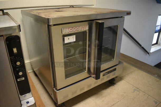 Blodgett Stainless Steel Commercial Full Size Convection Oven w/ View Through Doors, Metal Oven Racks and Thermostatic Controls on Commercial Casters. Goes GREAT w/ Lot 8! BUYER MUST REMOVE. 38.5x41x38. (Clearview Elementary - Upstairs Hallway) - Image 4 of 7