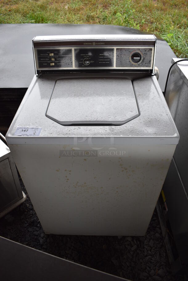 General Electric Metal Top Load Washer. BUYER MUST REMOVE. 27x25x44. (stadium)