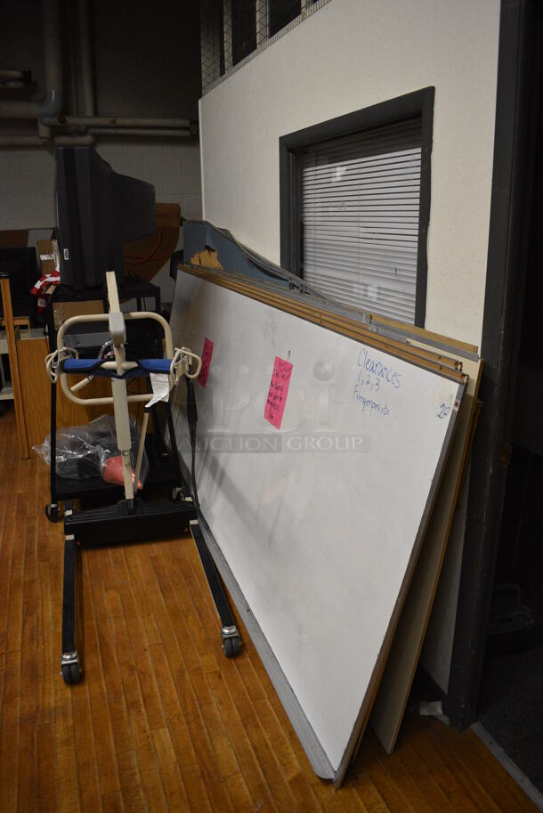ALL ONE MONEY! Lot of Various Items Including Whiteboards, AV Cart, Television, Carts and Maps. BUYER MUST REMOVE. Includes 21x21x30. (Clearview Elementary - Stage)