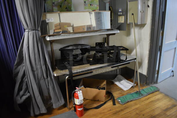 ALL ONE MONEY! Lot of Various Items Including Table, Mop, Mirror. Does Not Include Fire Extinguisher. BUYER MUST REMOVE. Includes 46x23x21. (Clearview Elementary - Stage) - Image 1 of 5