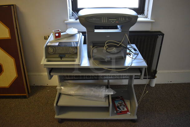 ALL ONE MONEY! Lot of Gray Table on Casters, and HP LaserJet 3300 Printer Copier Scanner. Does Not Come w/ Audiometer Shown In Pictures. BUYER MUST REMOVE. 36x20x29.5. (Clearview Elementary - Upstairs Hallway)