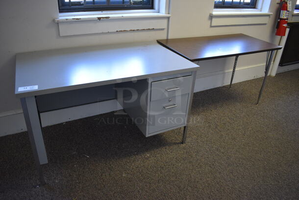 Gray Metal Desk. BUYER MUST REMOVE. 48x31x29 (Clearview Elementary - Upstairs Hallway)