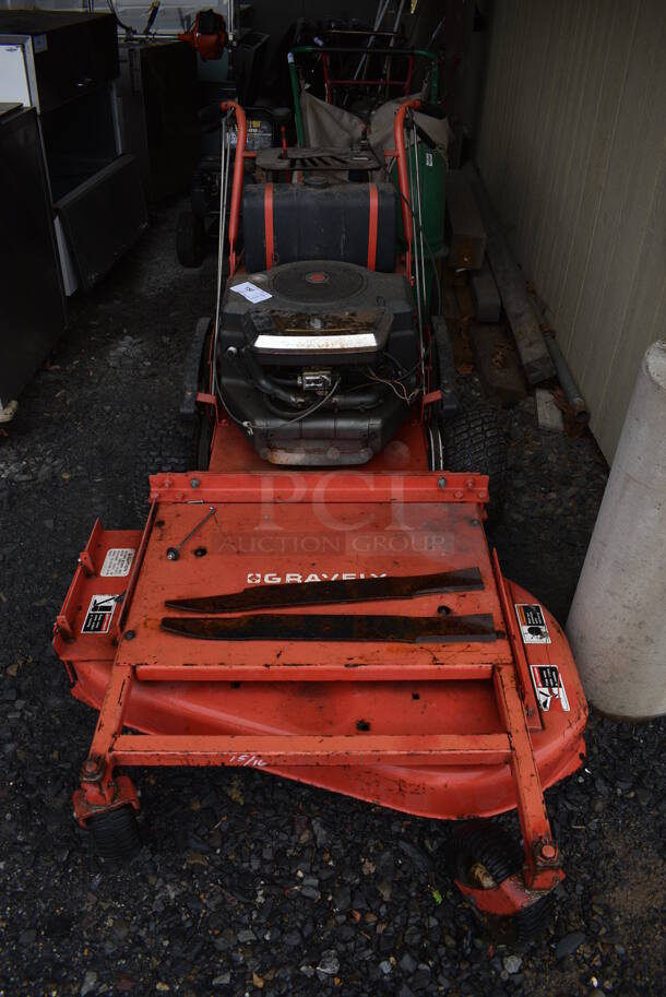 Gravely 36928 Metal Commercial Push Mower w/ 16 HP AT 3600 RPM 656 CC Twin Cylinder Briggs & Stratton Motor. BUYER MUST REMOVE. 41x72x41. (stadium)