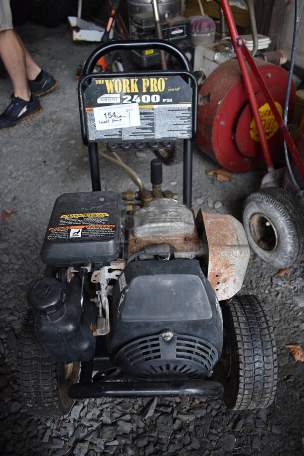 The Work Pro 2400 PSI Metal Pressure Washer. Unit Needs New Main Pump. BUYER MUST REMOVE. 20x28x25. (stadium)