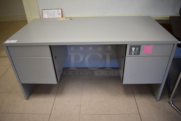 Gray Desk w/ 4 Drawers. BUYER MUST REMOVE. 60x30x29. (Clearview Elementary - Room 12) - Image 1 of 4