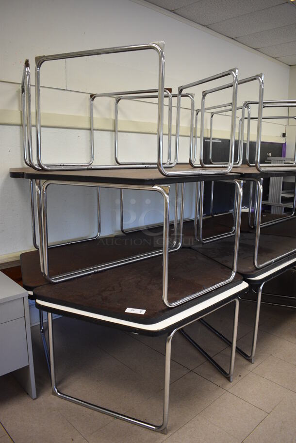 18 White Tables on Metal Legs. BUYER MUST REMOVE. 57x30x27. 18 Times Your Bid! (Clearview Elementary - Room 12)