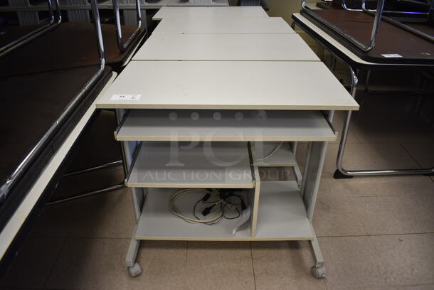16 Light Gray Desks on Casters. BUYER MUST REMOVE. 35.5x20x31.5. 16 Times Your Bid! (Clearview Elementary - Room 12)