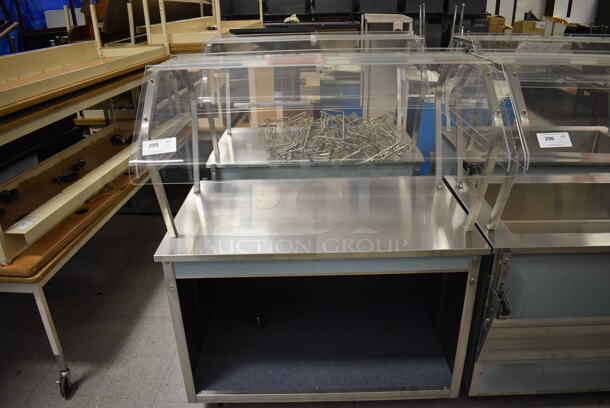 2 Vollrath Model 37045-2494-ANA Metal Commercial Serving Stations w/ Sneeze Guard and Tray Slide on Commercial Casters. 120 Volts, 1 Phase. 46x36x57.5. 2 Times Your Bid! (Clearview Elementary - Gym)