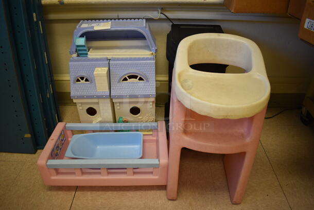 4 Various Children's Toys; Dollhouse, Crib, High Chair and Table. BUYER MUST REMOVE. Includes 12x21x7. 4 Times Your Bid! (Clearview Elementary - Room 10)