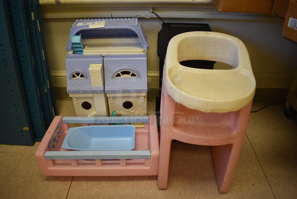4 Various Children's Toys; Dollhouse, Crib, High Chair and Table. BUYER MUST REMOVE. Includes 12x21x7. 4 Times Your Bid! (Clearview Elementary - Room 10) - Image 1 of 4