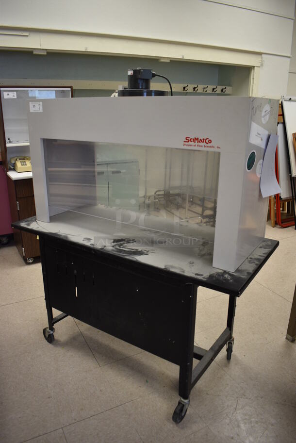 SciMatCo Metal Fume Hood on Black Metal Table on Casters. 115 Volts, 1 Phase. BUYER MUST REMOVE. 54x24x62. (Clearview Elementary - Room 10)