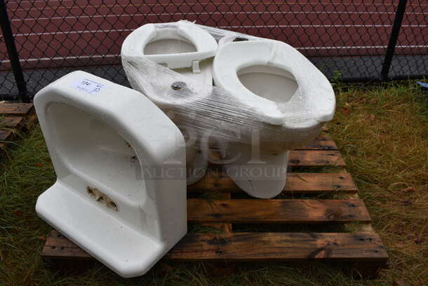 ALL ONE MONEY! Pallet Lot of Single Bay Wall Mount Sink and 2 Toilets. BUYER MUST REMOVE. Includes 19.5x18.5x11. (stadium)