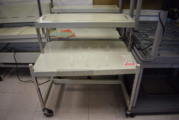 2 Metal Desks on Commercial Casters. BUYER MUST REMOVE. 36x24x39. 2 Times Your Bid! (Clearview Elementary - Room 8)