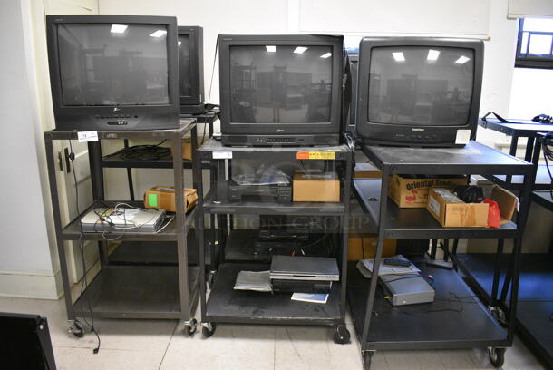 6 Black Metal AV Carts w/ 27" Television and Additional Contents on Commercial Casters. BUYER MUST REMOVE. Includes 28x24x48. 6 Times Your Bid! (Clearview Elementary - Room 8) - Image 1 of 8