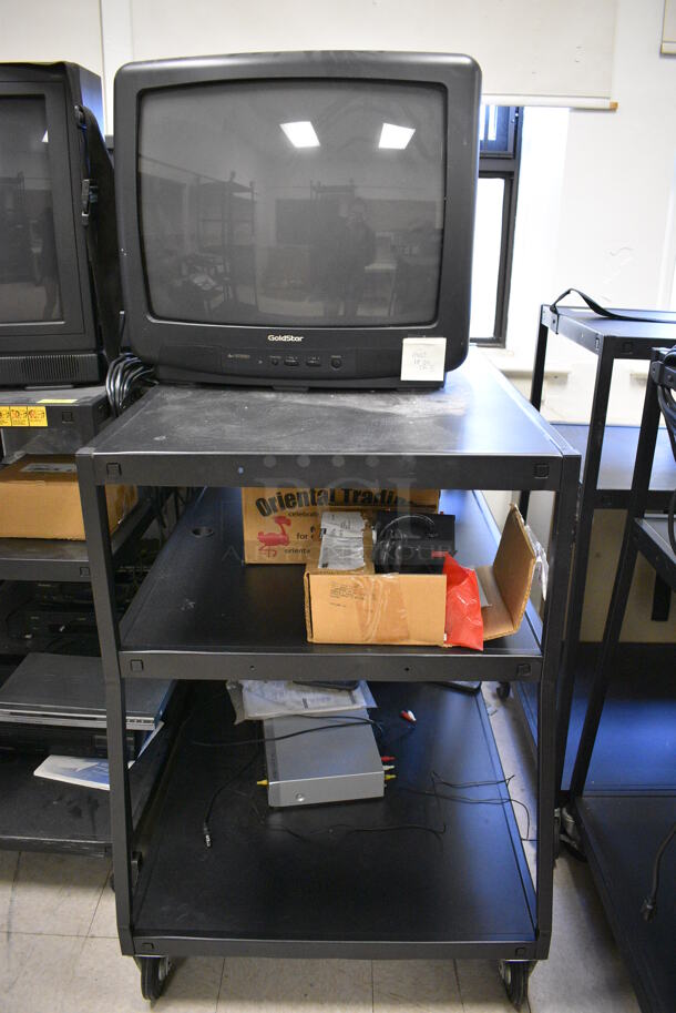 6 Black Metal AV Carts w/ 27" Television and Additional Contents on Commercial Casters. BUYER MUST REMOVE. Includes 28x24x48. 6 Times Your Bid! (Clearview Elementary - Room 8) - Image 2 of 8