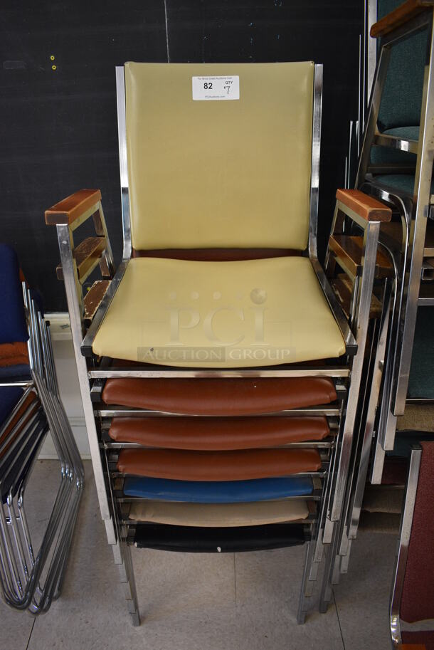 7 Various Colored Chairs w/ Arm Rests on Metal Frame. BUYER MUST REMOVE. 21x21x33. 7 Times Your Bid! (Clearview Elementary - Room 7)