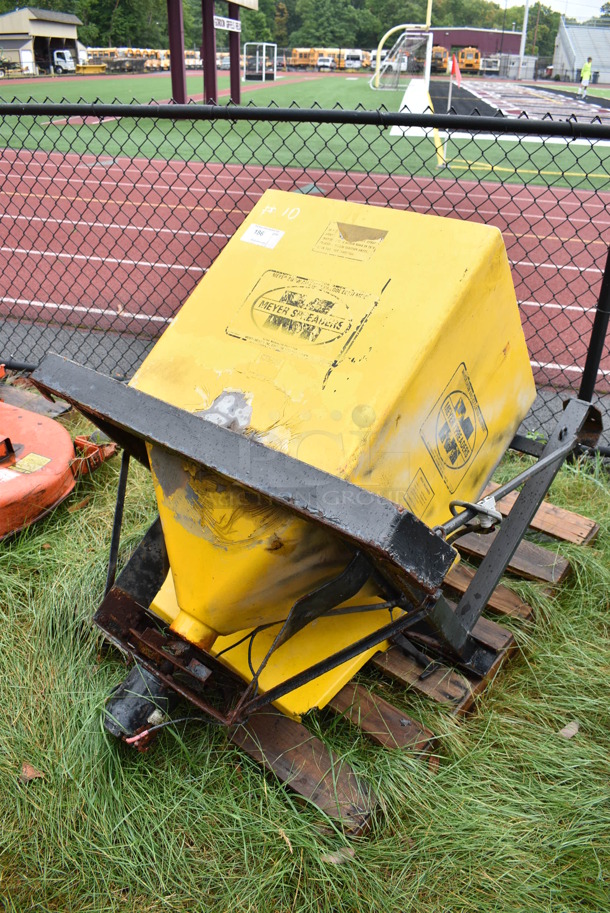 Meyer Yellow Metal Salt Spreader. BUYER MUST REMOVE. 41x32x49. (stadium)