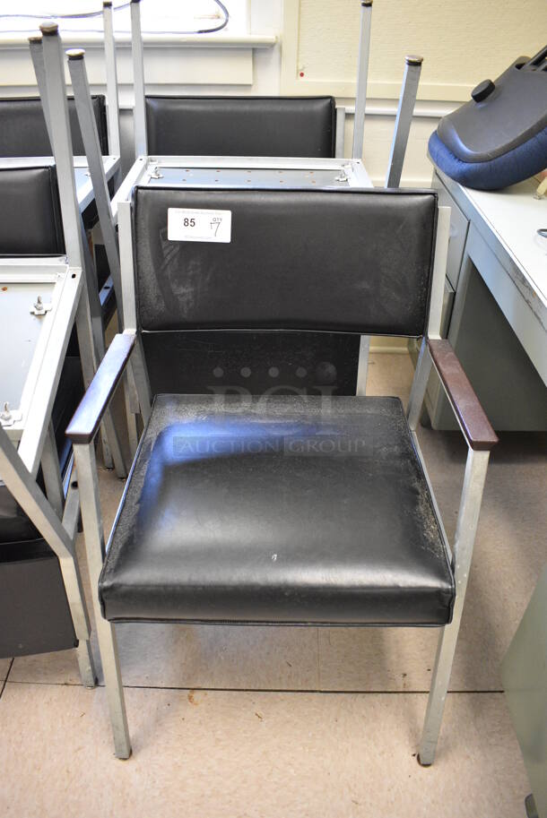 7 Black Chairs w/ Arm Rests on Metal Frame. BUYER MUST REMOVE. 22x22x32. 7 Times Your Bid! (Clearview Elementary - Room 7)