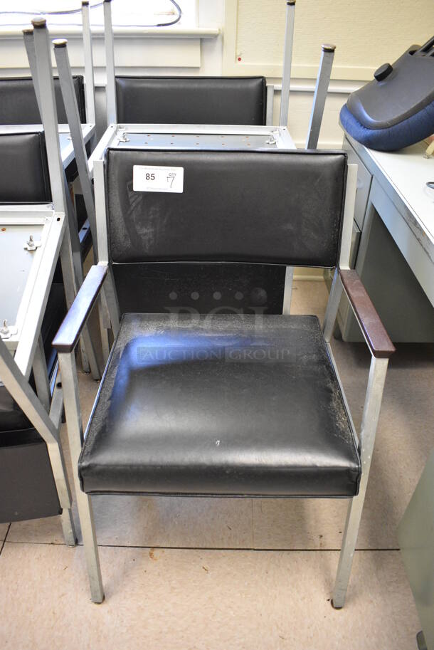 7 Black Chairs w/ Arm Rests on Metal Frame. BUYER MUST REMOVE. 22x22x32. 7 Times Your Bid! (Clearview Elementary - Room 7) - Image 1 of 4