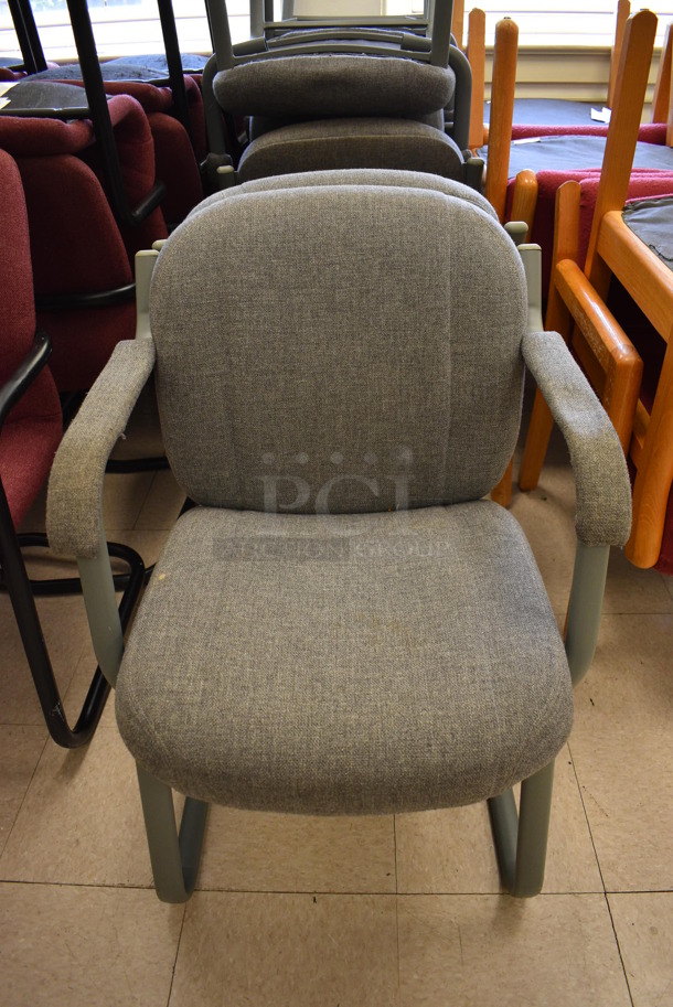 6 Gray Chairs w/ Arm Rests. BUYER MUST REMOVE. 24x24x34. 6 Times Your Bid! (Clearview Elementary - Room 7)