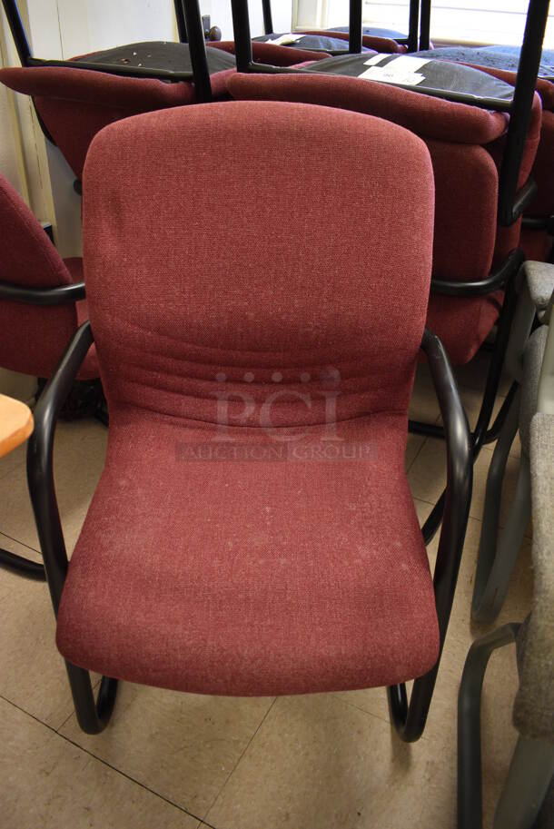 14 Maroon Chairs w/ Arm Rests on Black Metal Frame. BUYER MUST REMOVE. 22x22x36. 14 Times Your Bid! (Clearview Elementary - Room 7)