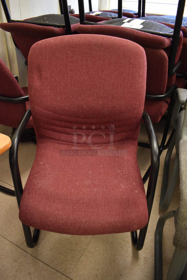 14 Maroon Chairs w/ Arm Rests on Black Metal Frame. BUYER MUST REMOVE. 22x22x36. 14 Times Your Bid! (Clearview Elementary - Room 7) - Image 1 of 3