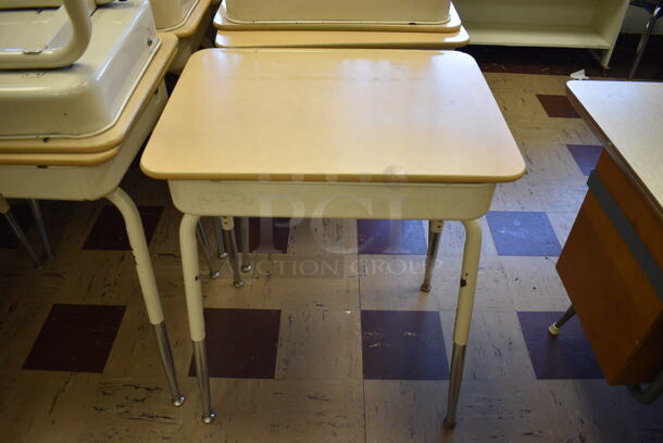 28 Tan Metal Student Desk w/ Raising Desktop. BUYER MUST REMOVE. 24.5x18.5x28. 28 Times Your Bid! (Clearview Elementary - Room 2)