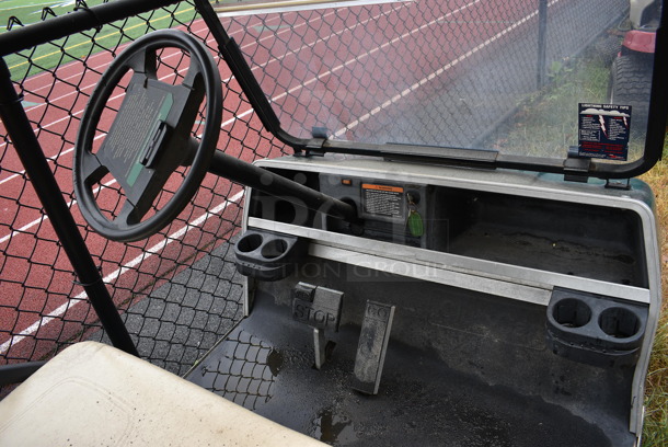 Green Electric Powered Golf Cart w/ Battery Charger. Needs New Battery. Comes w/ 1 Key. BUYER MUST REMOVE. 42x101x67.5. (stadium) - Image 5 of 11