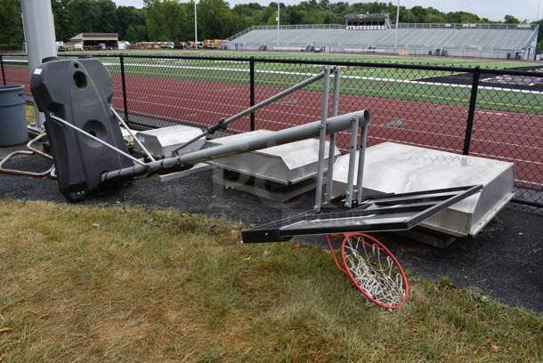 Spalding Metal Floor Style Basketball Hoop. BUYER MUST REMOVE. 52x48x132.5. (stadium)