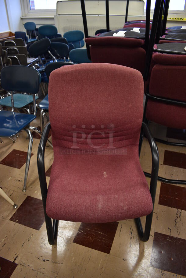 24 Maroon Chairs on Black Metal Frame. BUYER MUST REMOVE. 22.5x23x36. 24 Times Your Bid! (Clearview Elementary - Room 6)