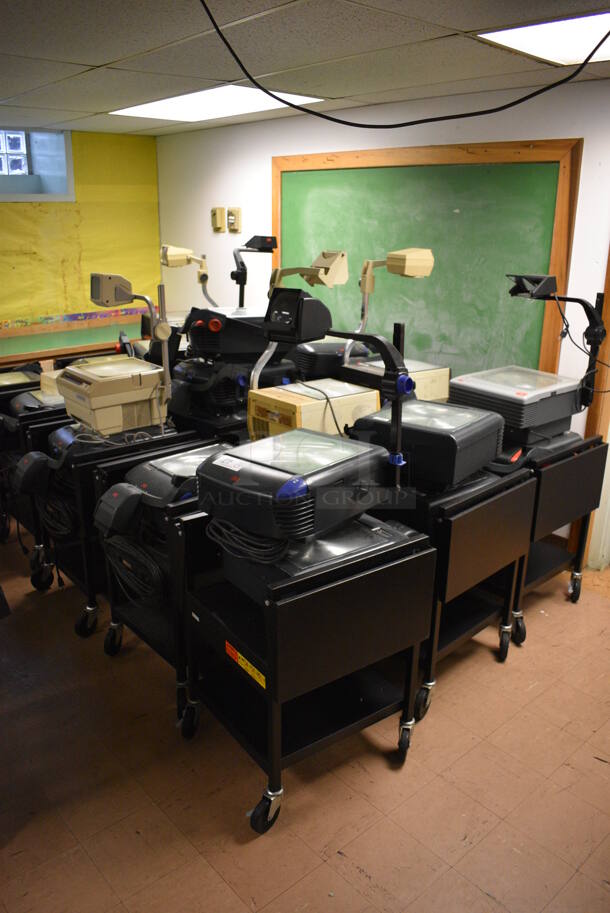 15 Black Metal AV Carts w/ Approximately 30 Overhead Projectors. BUYER MUST REMOVE. Includes 21x20x51. 15 Times Your Bid! (Clearview Elementary - Lower Level)